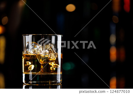 Whiskey on the rocks on a bar table 124877010