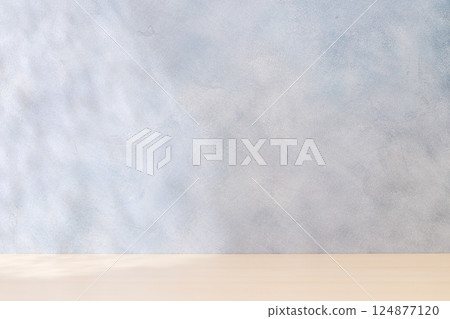 Template with empty table and wall with natural shadow and sunny glare Template with empty table and wall with natural shadow and sunny glare 124877120