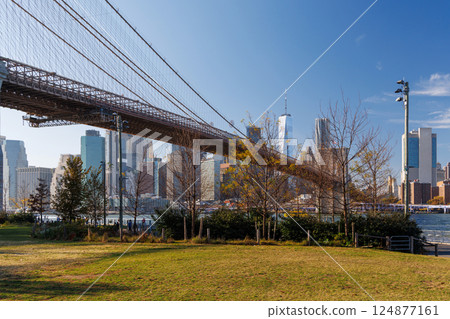 A panoramic view of the Brooklyn Bridge stretching towards Manhattan 124877161