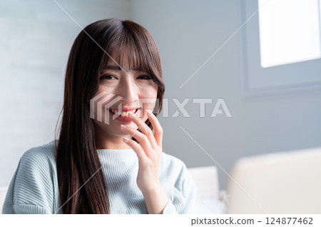 A young lady who operates a personal computer A young lady who operates a personal computer 124877462
