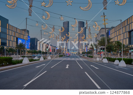 Lusail city, Qatar-March 21 2025: Lusail boulevard during Ramadan with illuminated decoration and the four Lusail towers 124877868