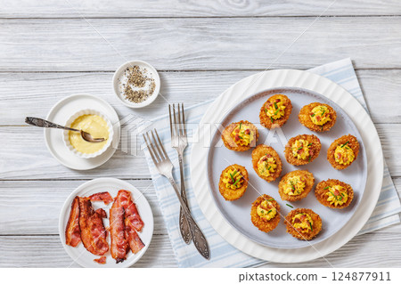 Deep fried deviled eggs with coating of panko Deep fried deviled eggs with coating of panko 124877911