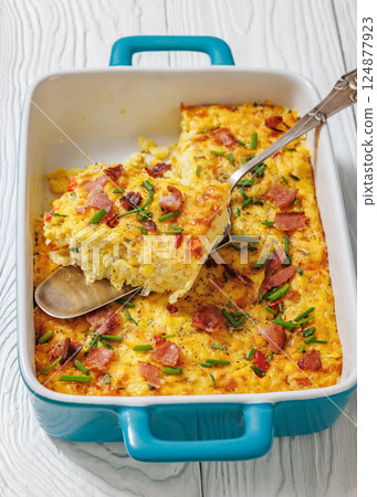 fresh corn pudding casserole in a baking dish fresh corn pudding casserole in a baking dish 124877923