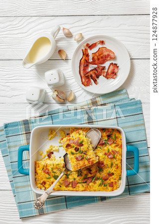 fresh corn pudding casserole in a baking dish fresh corn pudding casserole in a baking dish 124877928