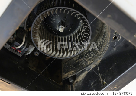 Ventilation fan being disassembled and cleaned (bathroom) 124878075