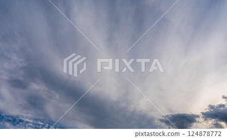 Thin clouds in the blue sky at dusk 124878772