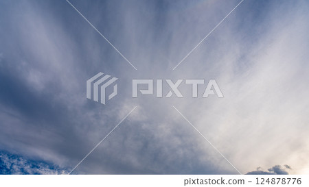 Thin clouds in the blue sky at dusk Thin clouds in the blue sky at dusk 124878776