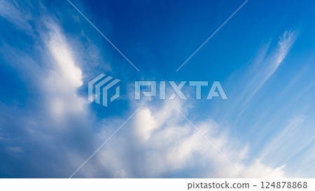 Thin clouds in the blue sky at dusk Thin clouds in the blue sky at dusk 124878868