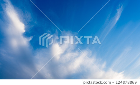 Thin clouds in the blue sky at dusk Thin clouds in the blue sky at dusk 124878869