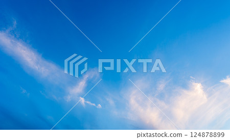 Thin clouds in the blue sky at dusk Thin clouds in the blue sky at dusk 124878899