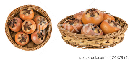 Brown fresh medlars in a wicker basket isolated on white background. Mespilus germanica . Top view. Flat lay 124879543