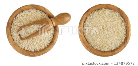 rice basmati in a wooden bowl isolated on white background. Top view. Flat lay 124879572