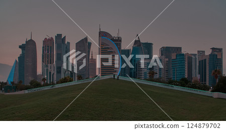 Doha , Qatar- October 19 2024: Doha skyline in west bay area sunset shot taken from the Hotel park. 124879702