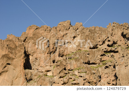 Rocky cliff in the Degollada del Aserrador. Rocky cliff in the Degollada del Aserrador. 124879729