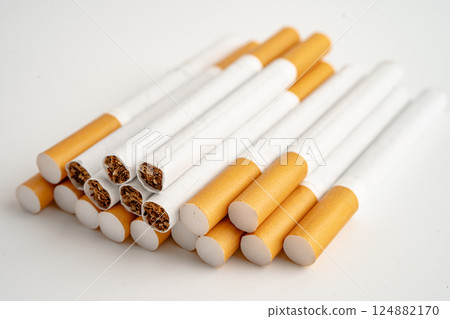 Cigarette on US dollar banknotes, cost, trading, marketing and production, No smoking, import export. 124882170