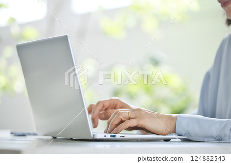 Middle woman using a computer in the living room 124882543