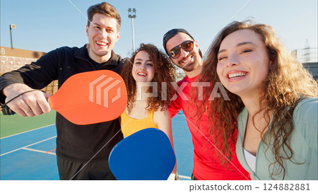 Group of smiling and happy friends posing for camera 124882881