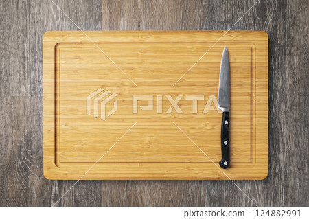 Empty cutting board with knife Empty cutting board with knife 124882991