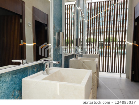 Wash stone basins at the hotel spa resort outside by swimming pool Wash stone basins at the hotel spa resort outside by swimming pool 124883037