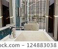 Wash stone basins at the hotel spa resort outside by swimming pool  124883038