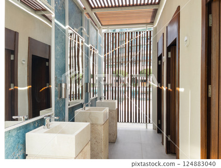 Wash stone basins at the hotel spa resort outside by swimming pool Wash stone basins at the hotel spa resort outside by swimming pool 124883040