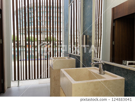Wash stone basins at the hotel spa resort outside by swimming pool Wash stone basins at the hotel spa resort outside by swimming pool 124883041
