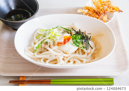 Udon noodles topped with soft-boiled egg Udon noodles topped with soft-boiled egg 124884673