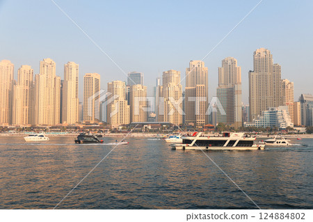 Dubai, United Arab Emirates - September 26, 2024 Dubai Promenade with JBR Beach, floating tourist boats. Editorial 124884802