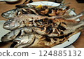 A mountain of grilled fish 124885132