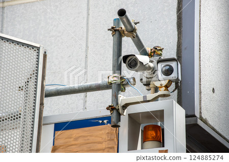 Surveillance camera at the entrance to the construction site Surveillance camera at the entrance to the construction site 124885274