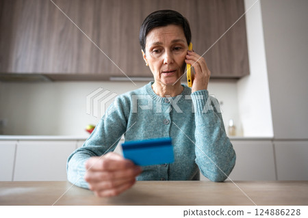 Scared confused naive woman transferring money accounts scammers phone fraud financial manipulation 124886228