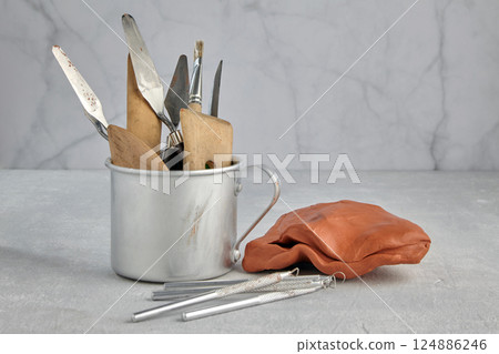 hobby and creative tools in the sculptor's studio on a stone table 124886246
