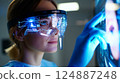 Dentist analyzing a complex, futuristic digital interface displaying a detailed 3D scan 124887248