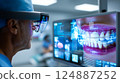 Dentist analyzing a complex, futuristic digital interface displaying a detailed 3D scan 124887252