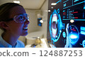 Dentist analyzing a complex, futuristic digital interface displaying a detailed 3D scan 124887253