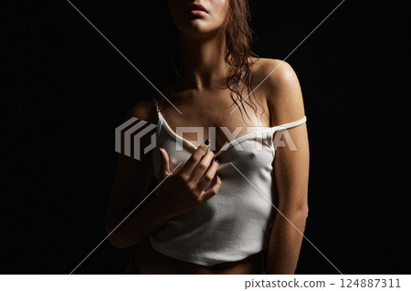 Sexy woman in wet shirt. Beautiful body Girl in the dark Sexy woman in wet shirt. Beautiful body Girl in the dark 124887311