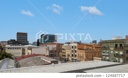 Cityscape of Barcelona with modern and traditional architecture under clear blue sky 124887717
