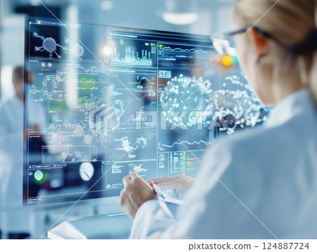 Female scientist analyzing complex molecular data on a futuristic transparent digital screen in a high-tech laboratory 124887724