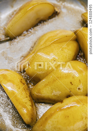 Savor the Amazing Flavor of Deliciously Caramelized Pears Delightfully Cooked in a Pan 124888495
