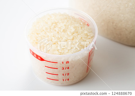 Rice in a measuring cup Rice in a measuring cup 124888670