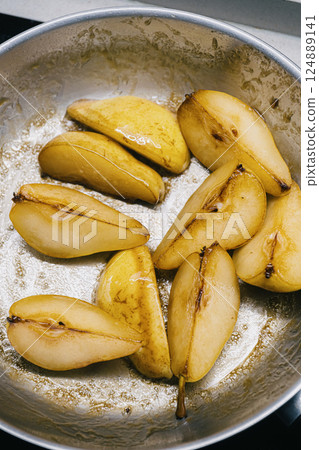 Deliciously Caramelized Pears Cooked to Perfection in a Beautiful Pan Ready to Serve 124889141