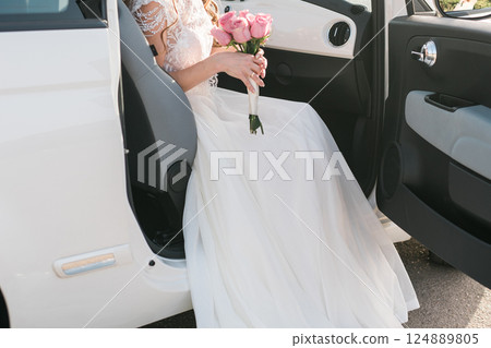 Bride holds a wedding bouquet, wedding dress, wedding details. Bride holds a wedding bouquet, wedding dress, wedding details. 124889805