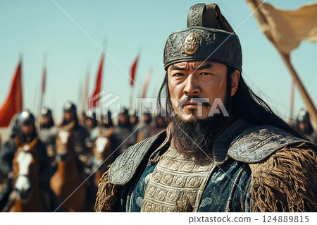 Genghis Khan leads the Mongolian army across the steppe in a dramatic battle moment 124889815