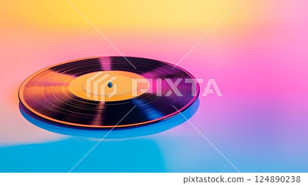 Record is sitting on a table. The record is black and yellow 124890238