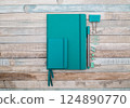 Notepad with pen and paper clips 124890770