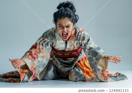 A woman in a kimono with her mouth open and her hands outstretched 124891131