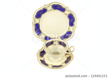 Porcelain vintage cup and saucer isolated on white background. Porcelain vintage cup and saucer isolated on white background. 124891251