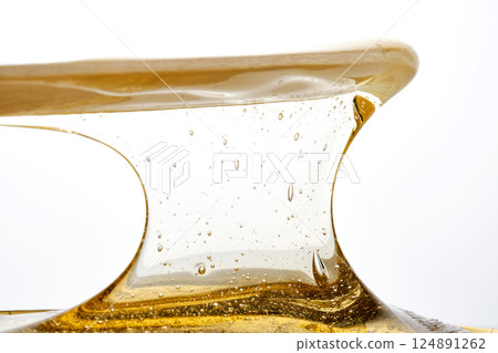 Photo of a sugar paste for depilation hair removal procedure. Texture. 124891262