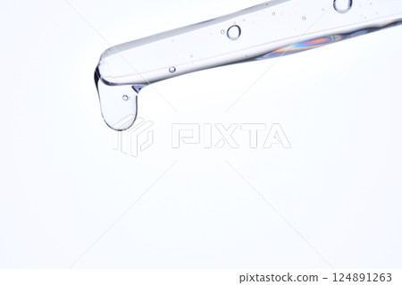 Pipette with delicate blue serum close-up. Pipette with delicate blue serum close-up. 124891263