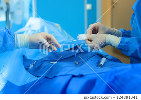 Laparoscopic surgery on abdominal cavity. Surgeons' hands. Modern surgery. Concept of health. Laparoscopic surgery on abdominal cavity. Surgeons' hands. Modern surgery. Concept of health. 124891341